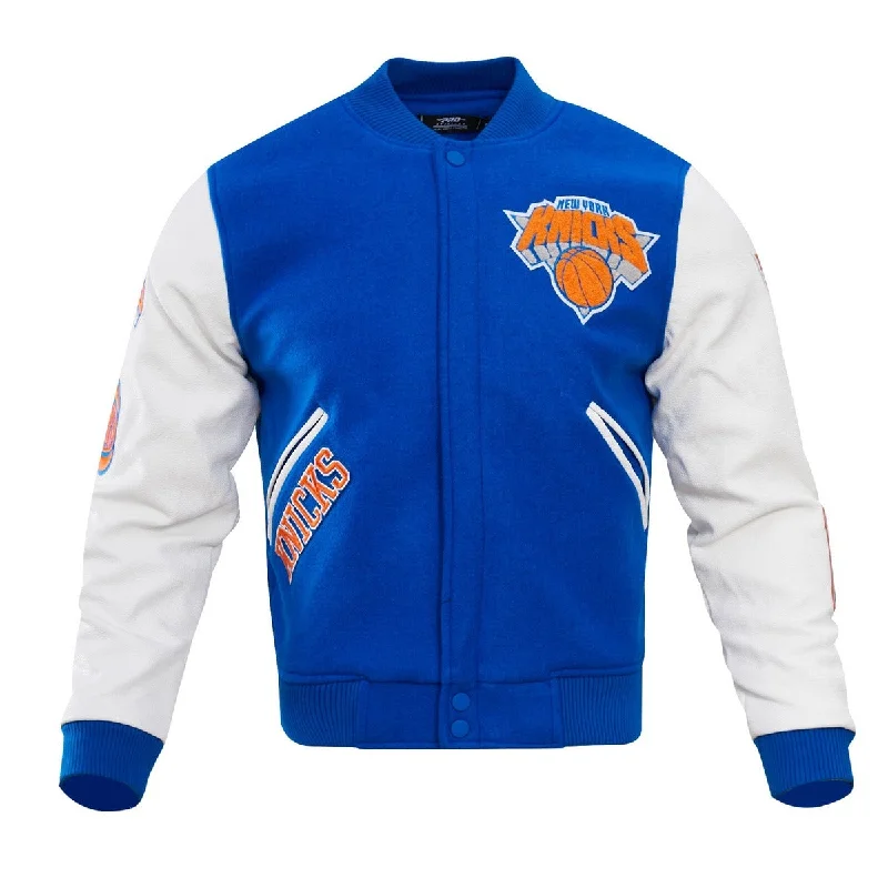 NBA NEW YORK KNICKS CLASSIC WOOL MEN'S VARSITY JACKET (ROYAL/WHITE) Snapped Jacket Toggled Jacket Drawstring Jacket NBA NEW YORK KNICKS CLASSIC WOOL MEN'S VARSITY JACKET (ROYAL/WHITE) Snapped Jacket Toggled Jacket Drawstring Jacket
