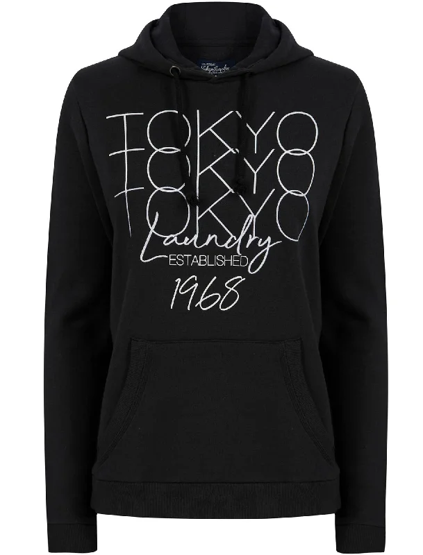 Areli Embroidered Motif Brushback Fleece Pullover Hoodie in Jet Black - Tokyo Laundry Surplice Neck Pullover