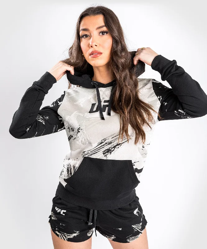 UFC Venum Authentic Fight Week 2.0 Women’s Pullover Hoodie - Sand/Black Short Sleeve Top UFC Venum Authentic Fight Week 2.0 Women’s Pullover Hoodie - Sand/Black Short Sleeve Top